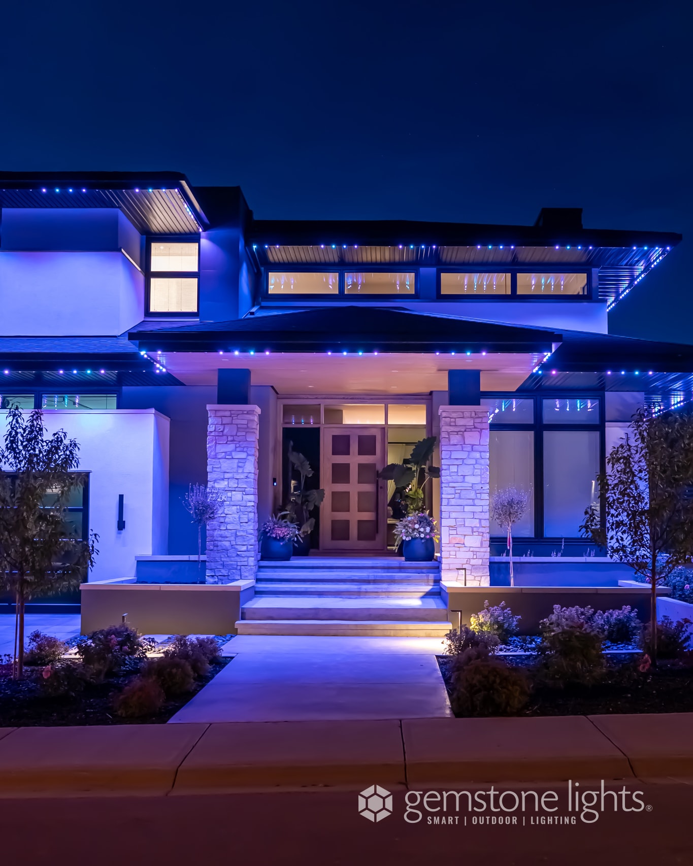 Elegant blue architectural lighting on modern prairie home