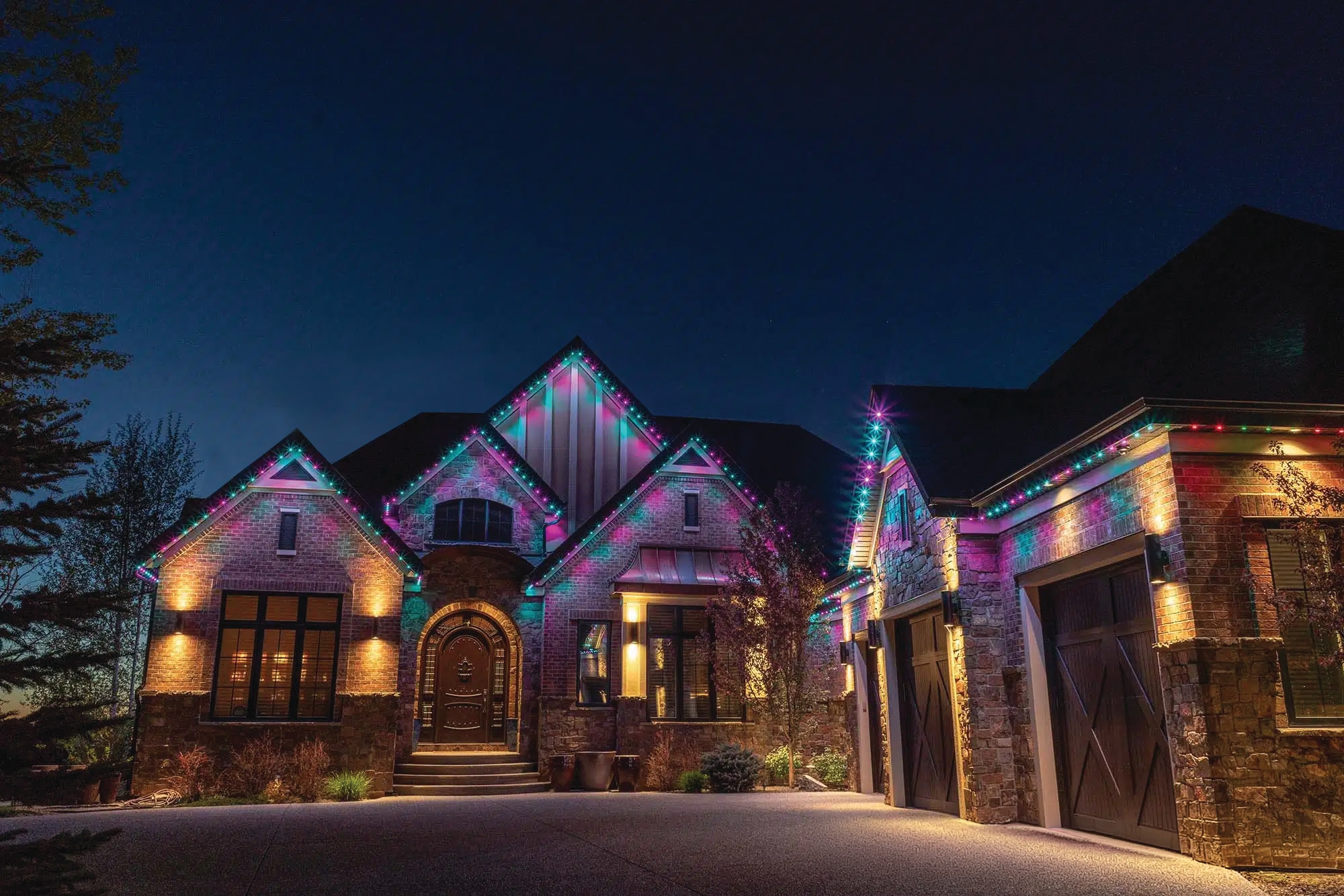 Brick home with multicolor Gemstone Lights installation